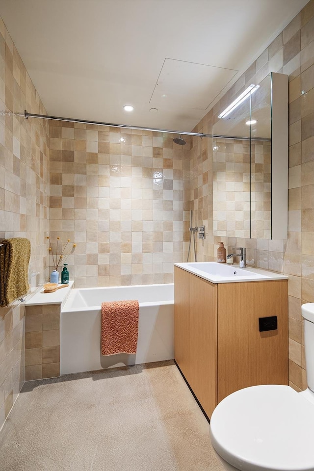 full bath featuring a bathtub, toilet, tile walls, a shower, and vanity
