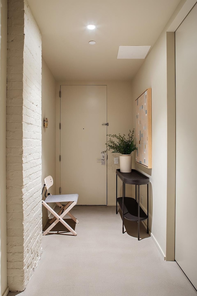 doorway featuring carpet flooring