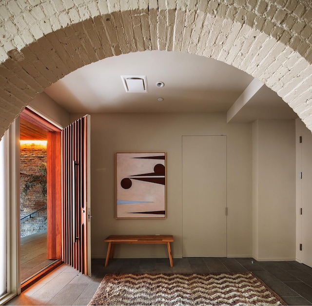 entrance foyer with tile patterned floors and visible vents