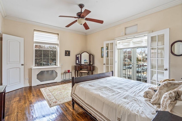 bedroom featuring hardwood / wood-style floors, ornamental molding, and a ceiling fan