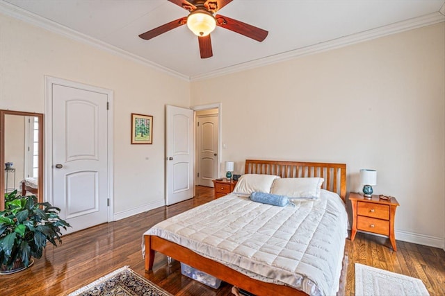 bedroom featuring crown molding, wood finished floors, baseboards, and ceiling fan