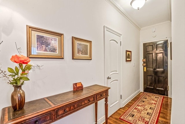 entrance foyer featuring ornamental molding and wood finished floors