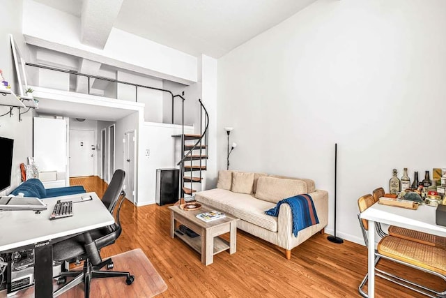 office with baseboards and light wood finished floors