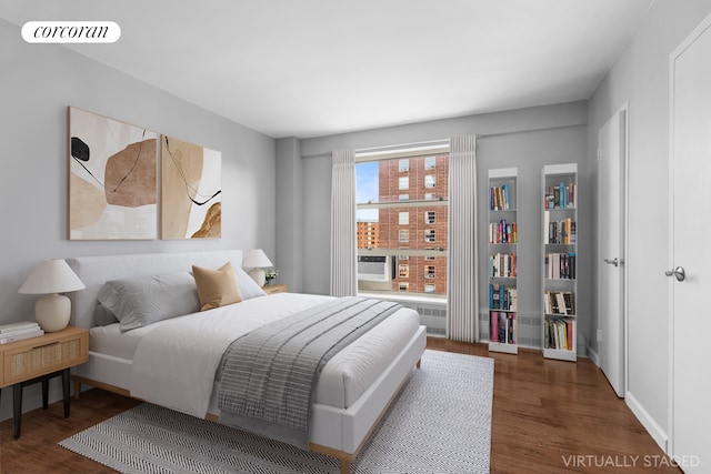 bedroom with wood finished floors and visible vents