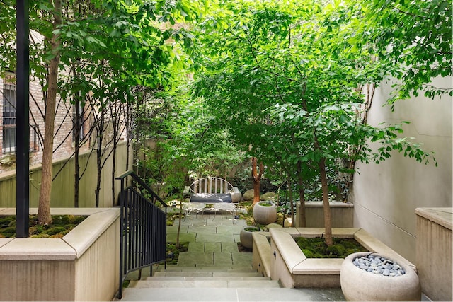 view of patio featuring fence