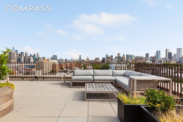 view of patio with an outdoor hangout area and a city view