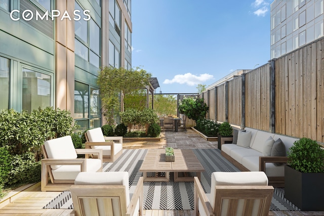 view of patio / terrace with fence and an outdoor hangout area