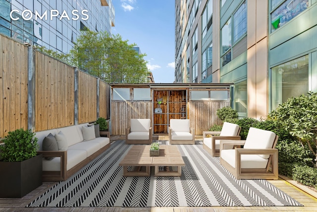 view of patio / terrace featuring fence and an outdoor hangout area