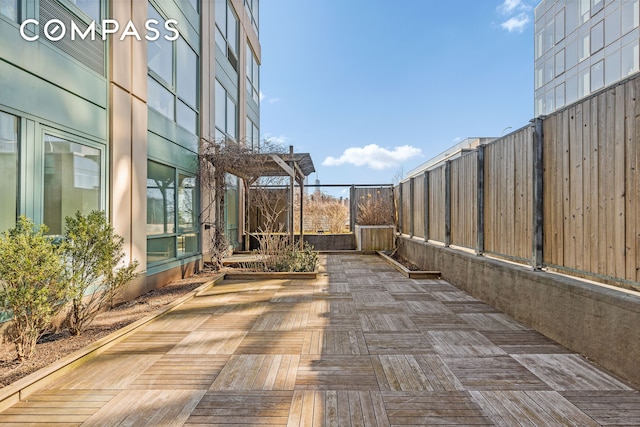 view of patio / terrace featuring fence