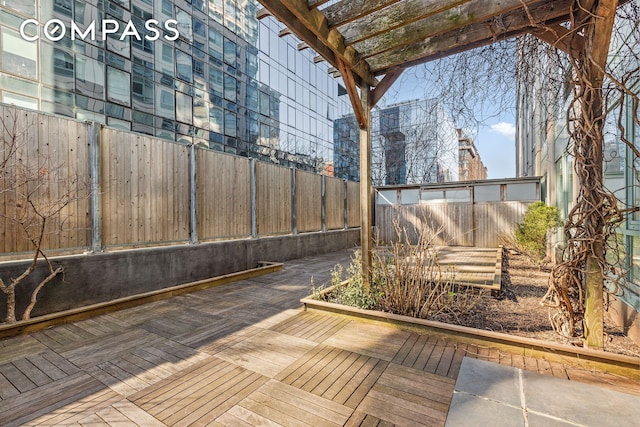 deck with a fenced backyard