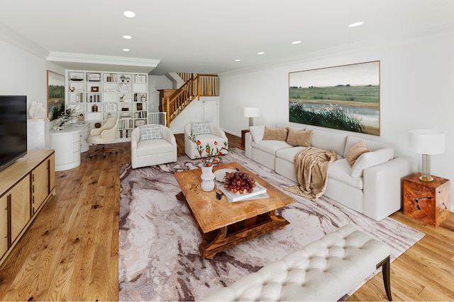 living area with stairs, recessed lighting, crown molding, and light wood finished floors