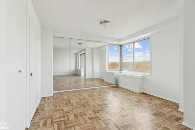 empty room with baseboards