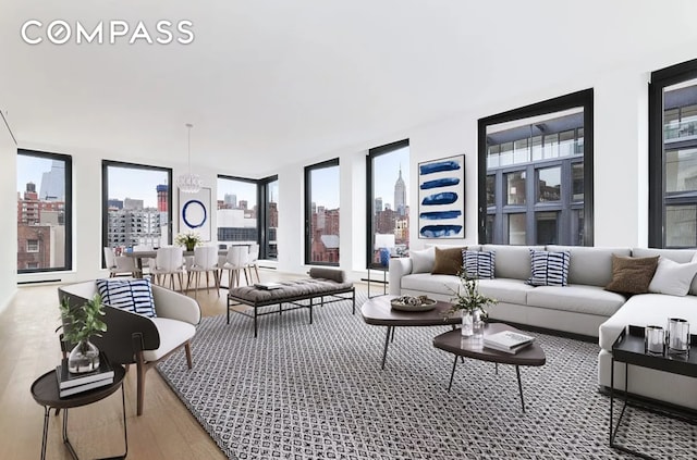 living room featuring a view of city and wood finished floors