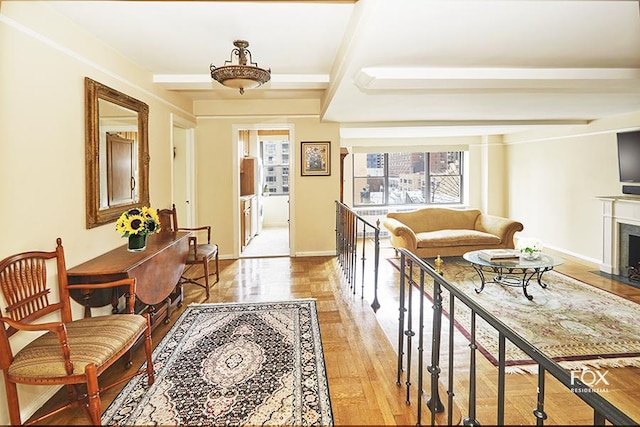 235 E 73rd St Unit 8D, New York City, NY 10021 - entrance foyer featuring light wood-type flooring, a fireplace, and baseboards