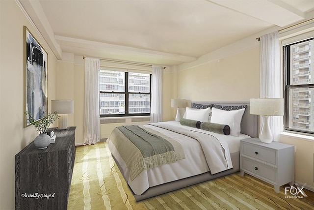 bedroom featuring light wood-style flooring