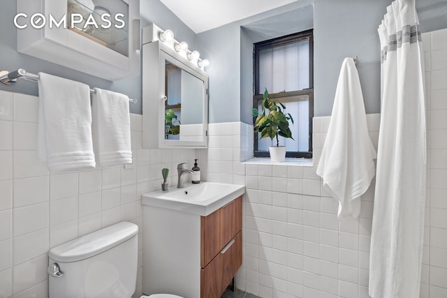 full bath with vanity, tile walls, toilet, and a shower with curtain