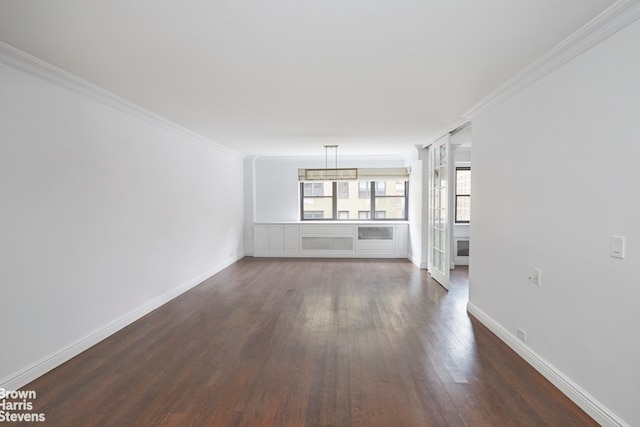 unfurnished living room featuring dark wood-style floors, baseboards, and ornamental molding