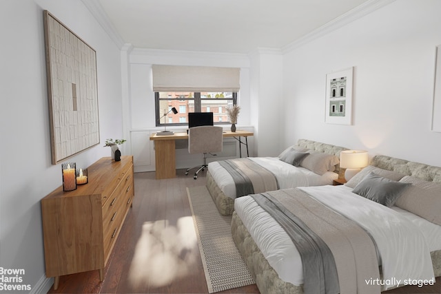 176 E 77th St Unit 7D, New York City, NY 10075 - bedroom with ornamental molding, a desk, and wood finished floors