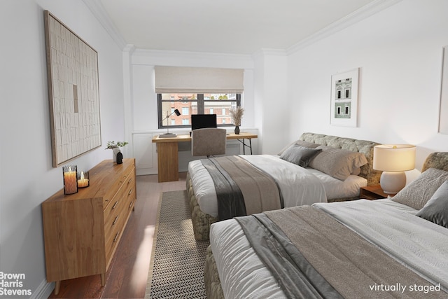 bedroom with wood finished floors and ornamental molding