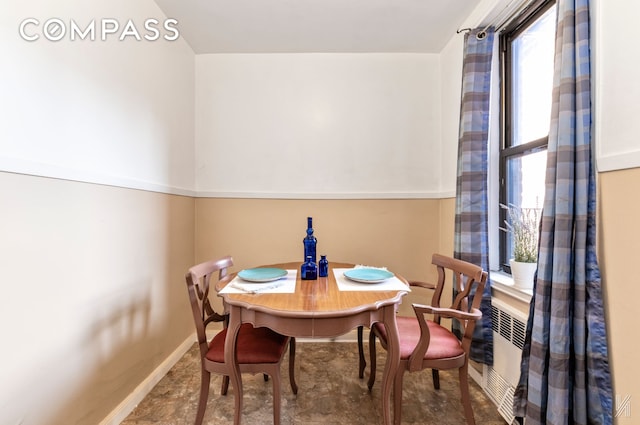 dining room featuring baseboards