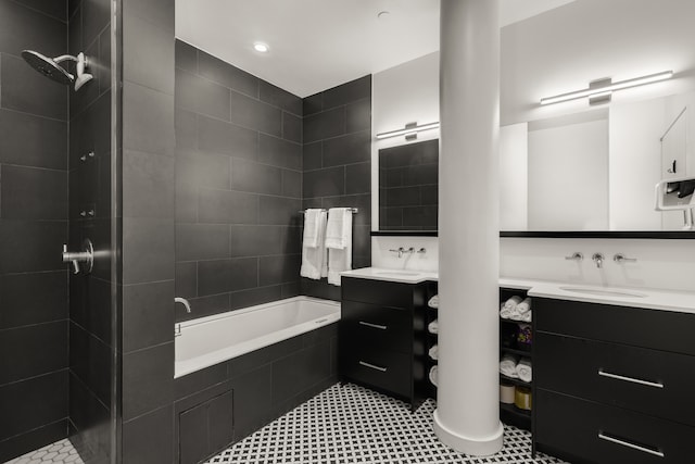 full bath with a tile shower, a tub, and vanity