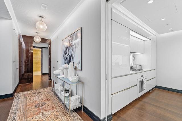 53 W 53rd St Unit 20C, New York City, NY 10019 - hallway featuring dark wood finished floors, baseboards, and recessed lighting