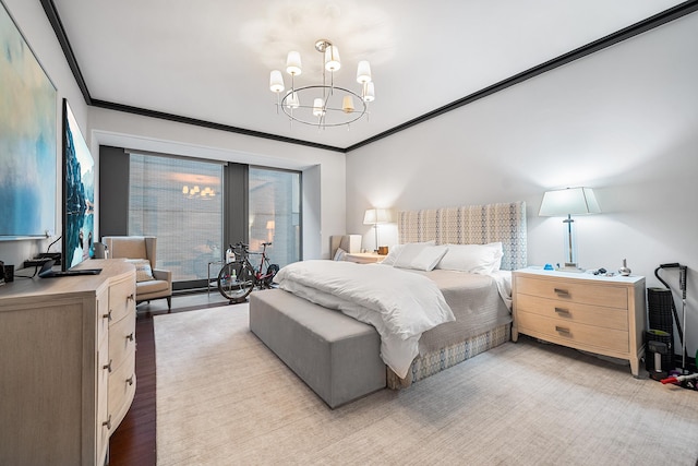 bedroom with a notable chandelier, light wood-style flooring, and ornamental molding