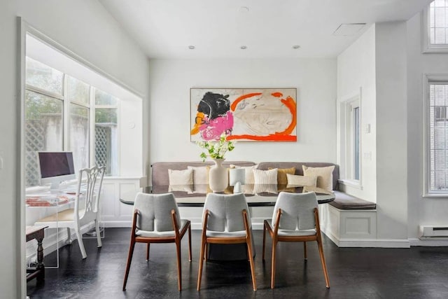 123 E 69th St, New York City, NY 10021 - dining space featuring breakfast area, baseboard heating, and dark wood-type flooring