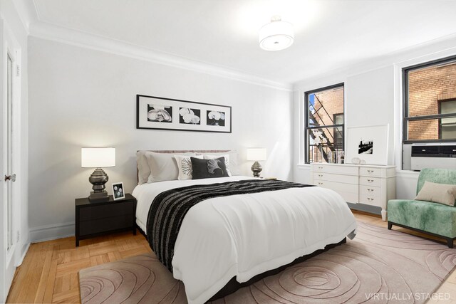 bedroom featuring ornamental molding, cooling unit, and baseboards