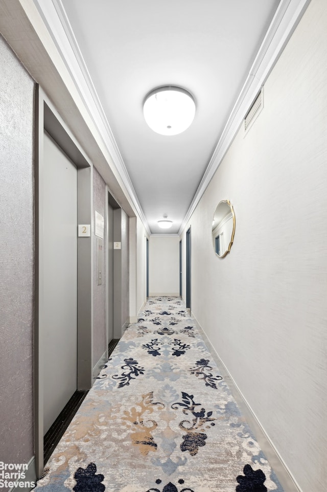 corridor with elevator, visible vents, and ornamental molding