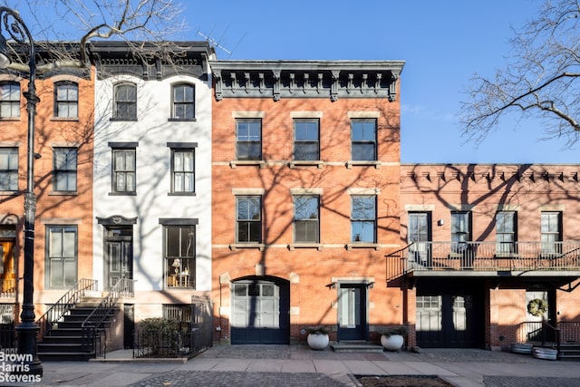 multi unit property featuring brick siding