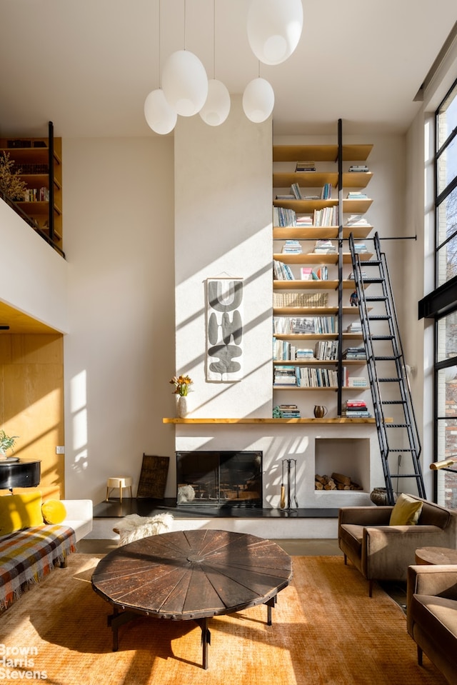 living room featuring a towering ceiling