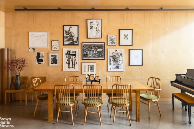 dining space with concrete flooring