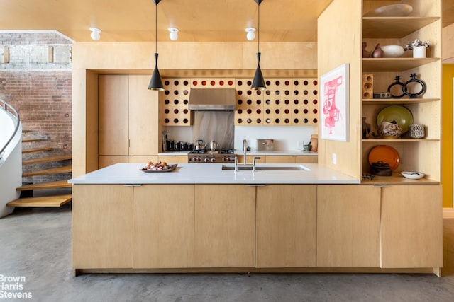 interior space featuring under cabinet range hood, finished concrete floors, light brown cabinets, and open shelves