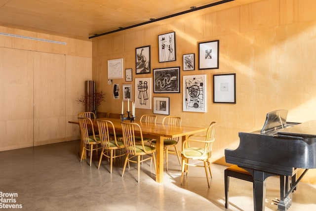 dining room with concrete flooring