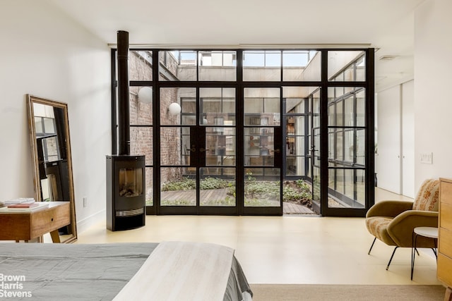 bedroom featuring floor to ceiling windows