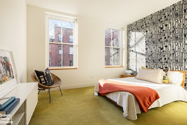 bedroom with carpet flooring and baseboards