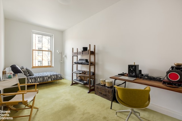 carpeted office space featuring baseboards and lofted ceiling