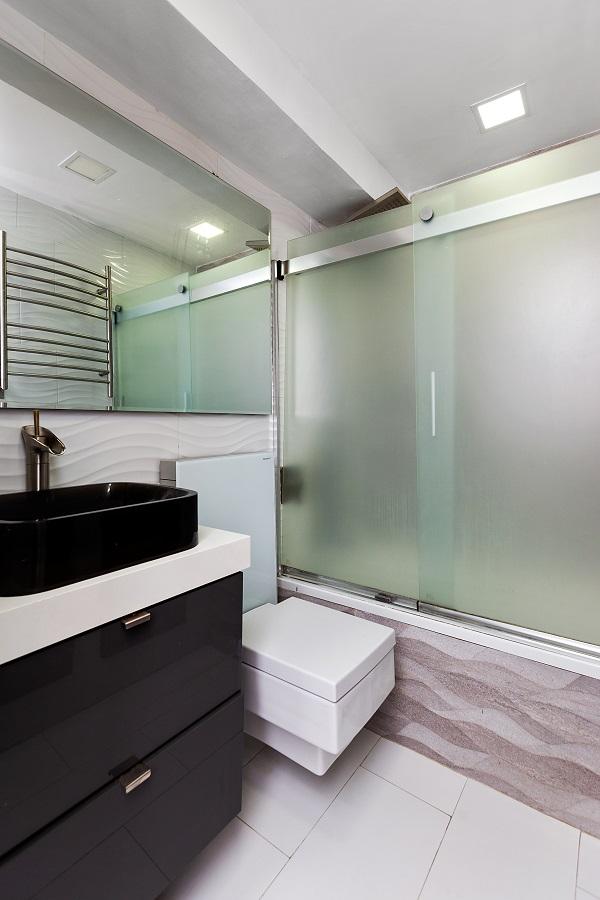 bathroom featuring vanity, toilet, radiator heating unit, and tile patterned flooring