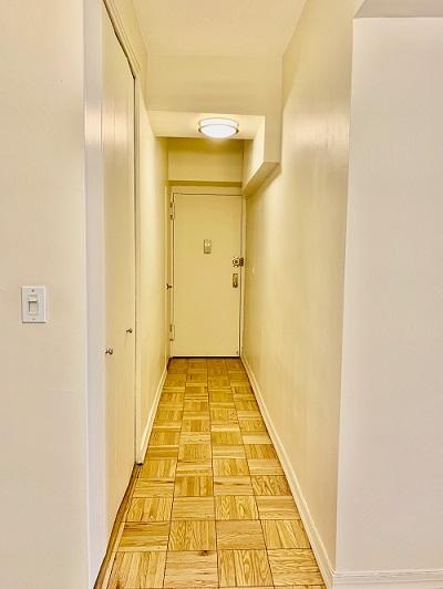 corridor featuring baseboards