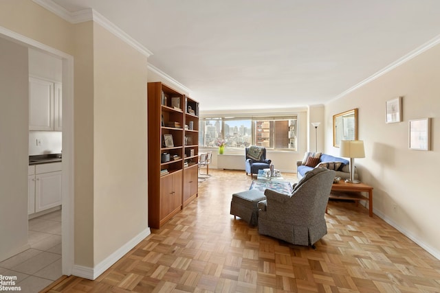 living room with baseboards and ornamental molding