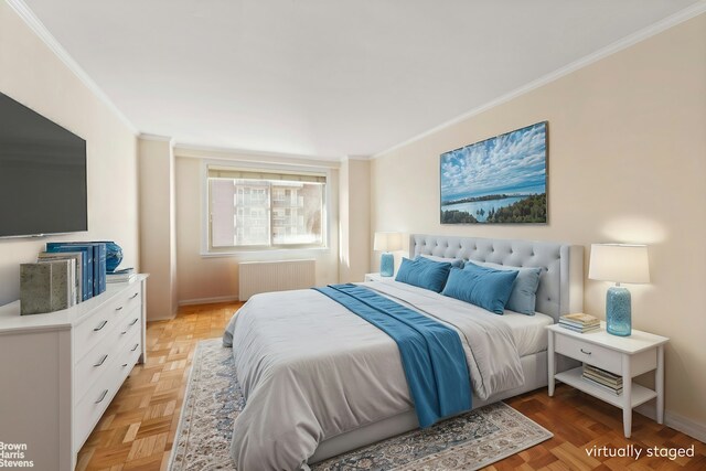 bedroom with radiator, ornamental molding, and baseboards