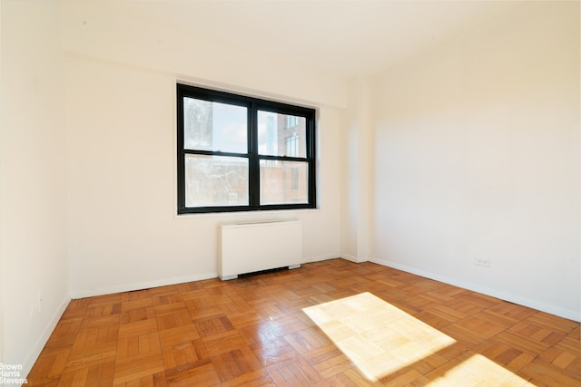 20 W 64th St Unit 12P, New York City, NY 10023 - unfurnished room with radiator heating unit and baseboards