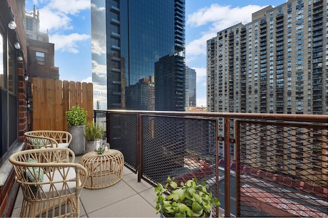 balcony featuring a city view