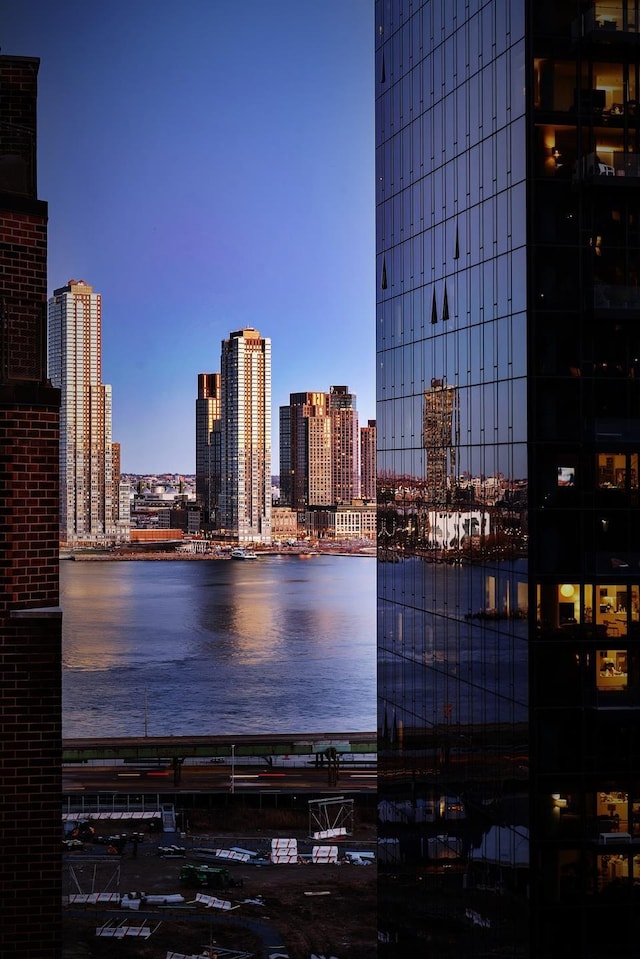 property's view of city with a water view