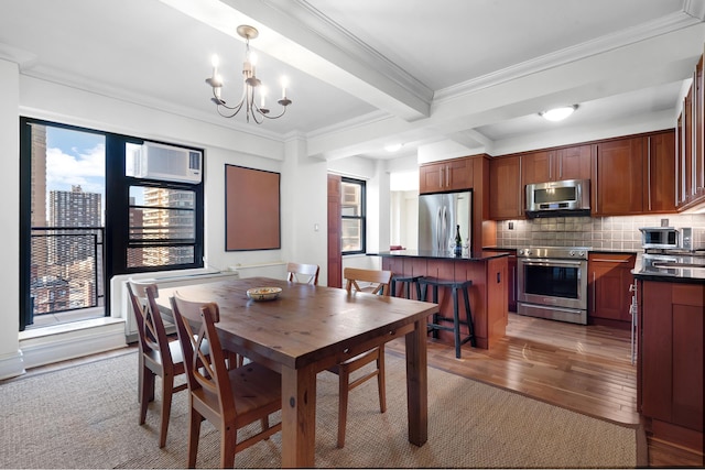 dining space featuring light wood-style flooring, an AC wall unit, crown molding, beamed ceiling, and a chandelier