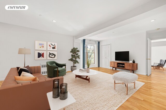 754 E 6th St Unit 4E, New York City, NY 10009 - living room featuring light wood finished floors, baseboards, recessed lighting, and radiator
