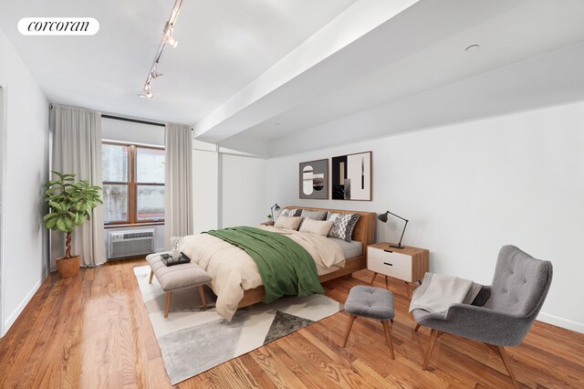 754 E 6th St Unit 4E, New York City, NY 10009 - bedroom featuring track lighting, wood finished floors, baseboards, and cooling unit