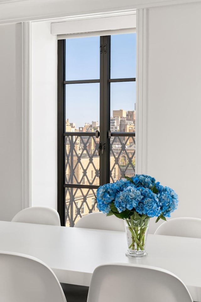 dining space featuring a view of city and french doors