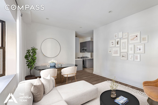 living room featuring wood finished floors and baseboards